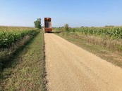 truck dumping limestone on an aggregate trail