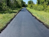 freshly sealed paved trail