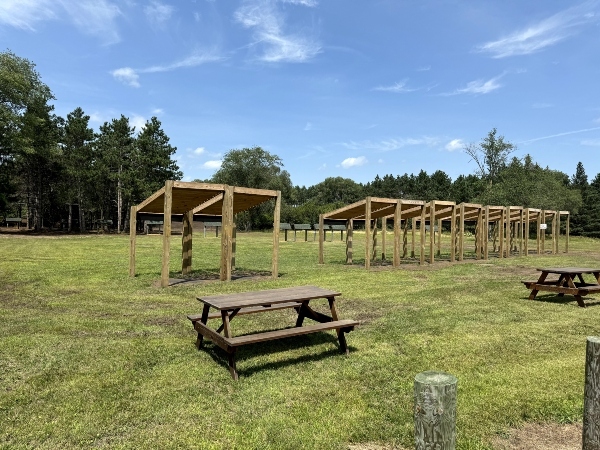 row of wooden pergolas