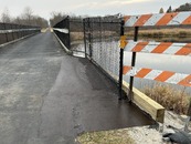 paved trail going over a river