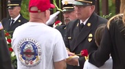 Chief Butler presenting flag to Shane's family