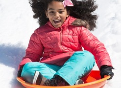 Child on sledding hill