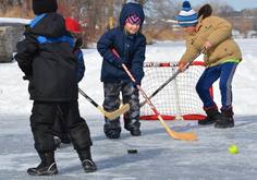 Kids playing boot hockey in Saint Paul
