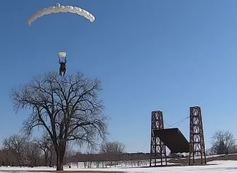 Mayor Carter skydiving into Harriet Island