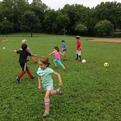 Roaming Recreation kids playing on grass