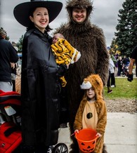 Family at a Parks and Rec Halloween party.