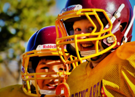 Youth football players in yellow jerseys. 