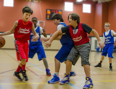 Youth boys basketball action shot