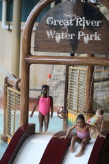 Two youth on water slides at Great River Water Park.