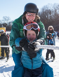 Instructor and student on using the tow rope at Como Park Ski Center