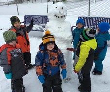 Youth building a snowman