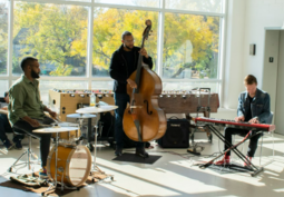 Musicians playing musical instruments at Frogtown Community Center as part of the Mobile Jazz Project. 