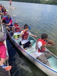 Youth canoeing on Lake Phalen at the Amazing Race event