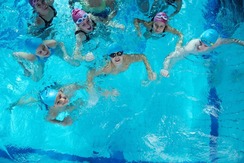 Young people participating in a swim class
