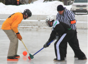 Adult Broomball face off