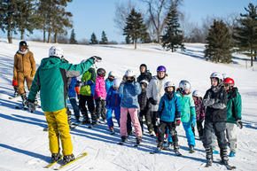 Ski instructor with youth group on Como Park ski hill