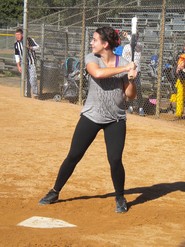 Adult softball player at bat