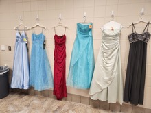 Prom dresses hanging on wall