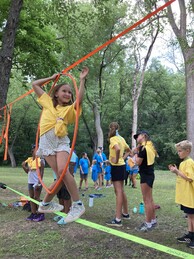 Youth on an Amazing Race obstacle course. 