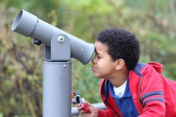 Youth looking into a view finder 