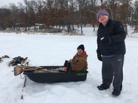 Adaptive Rec participants outside on a sled in the snow