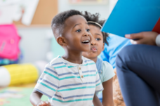 Two preschoolers at story time