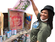 Girl smiling with stencil art project