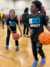 Youth playing basketball at open gym