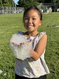 Girl holding up foam