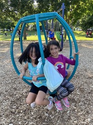 Youth on spinning playground equipment