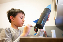 Kid building a rocket