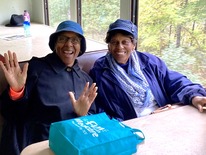 Two Seniors posing during field trip on train