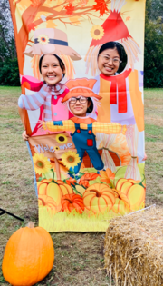 Fall festival hole board with scarecrow body