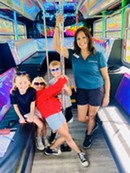 Staff with youth on party bus