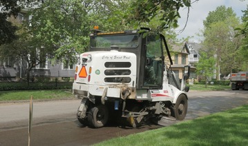 street sweeper vehicle on a St Paul street