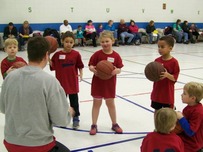 Basketball coach in huddle with players