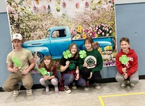 Group with paper 4-leaf clovers_spring event