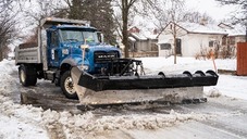 Snow plow on a city street