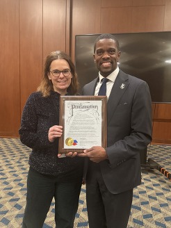 Mayor Melvin Carter presenting proclamation to Andrea Ledger. 