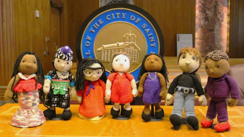 The Saint Paul City Council as crocheted dolls, handcrafted by Nichelle Bottko Woods.