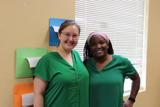 Two nurses smiling for the camera