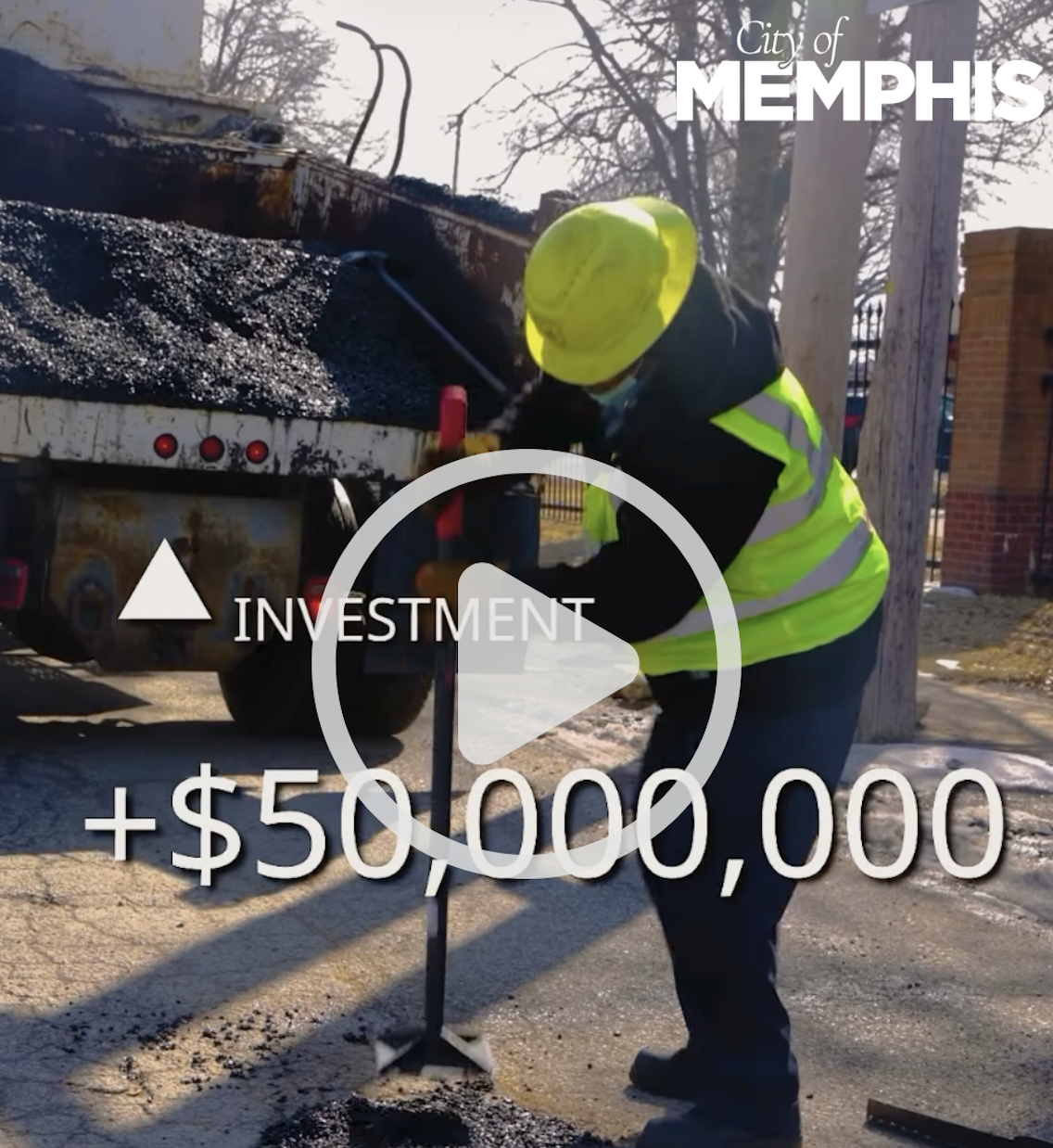 Photo of a city employee fixing a pothole to represent the tax dollars at work. 