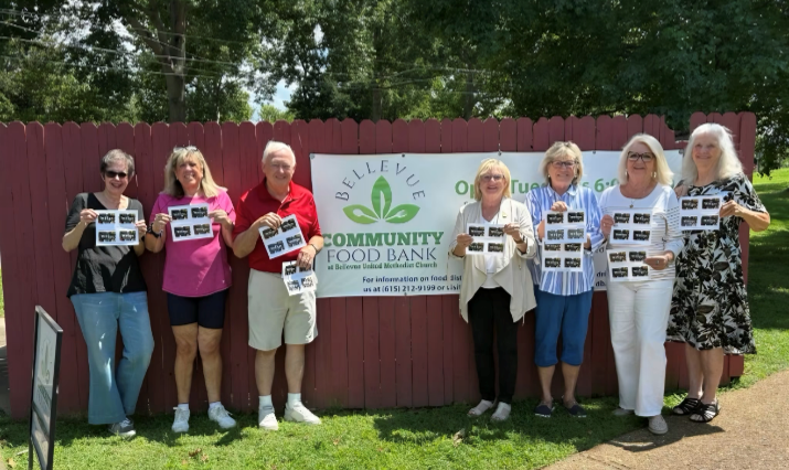 Group in front of Bellevue Community Food Bank banner