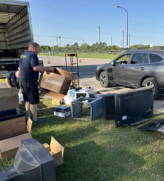 Residents dropping off electronics at Chunk Your Junk