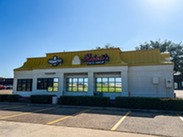 Exterior of Robertos Taco Shop on a Sunny Day