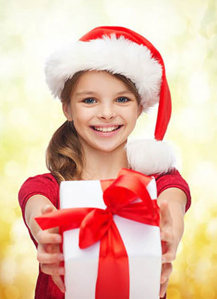 Photo of a young girl holding a present