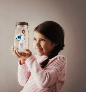 Photo of a girl imagining a career as an astronaut.