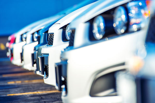 Image of a row of shiny car hoods 