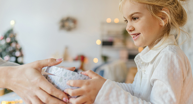 Young girl receives a gift.