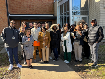 A group of city employees with Councilmember Arnold standing outside as part of the Beckley Avenue block walk